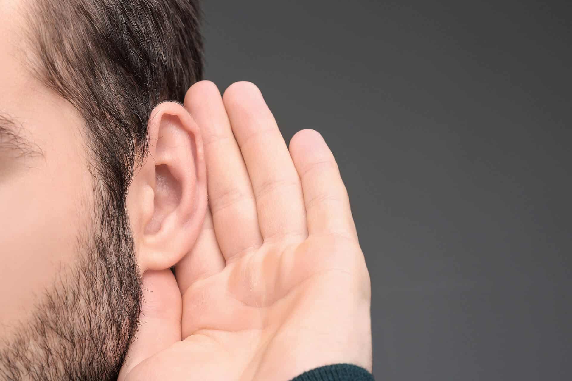 man with hearing loss trying to hear